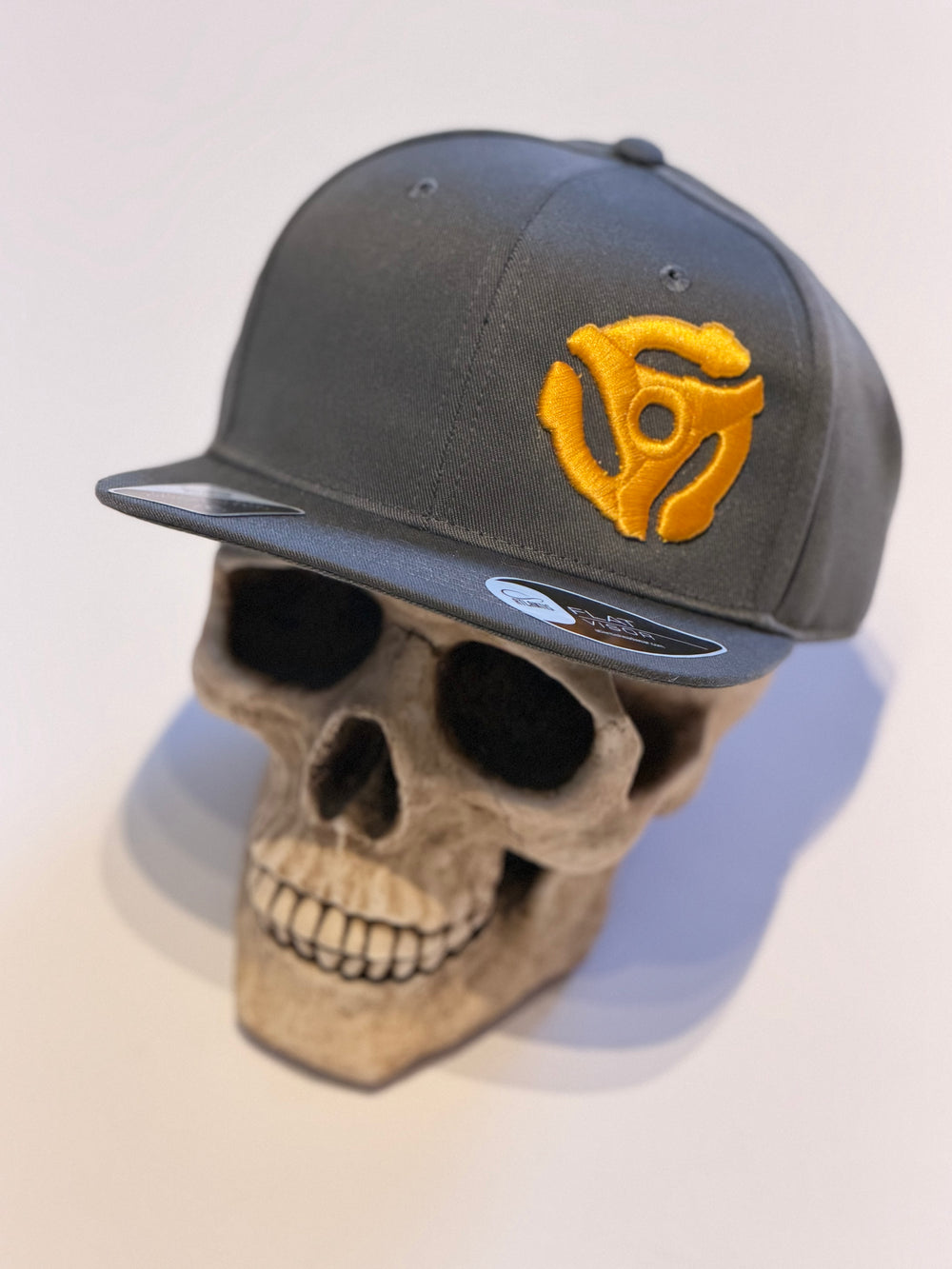 45 RPM Spider Adaptor - Grey Flat Cap - Built from Bottles. Worn for Vinyl